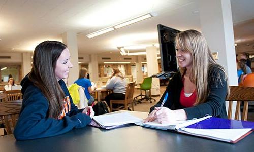 two female students in the learning commons 